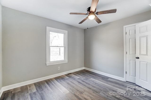 unfurnished room featuring ceiling fan and hardwood / wood-style floors