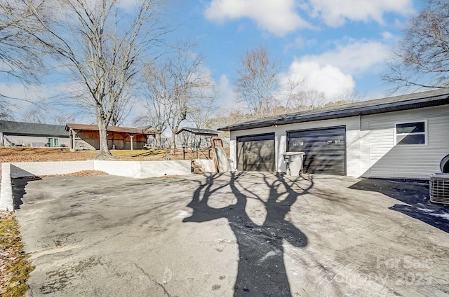 exterior space featuring a garage and an outdoor structure