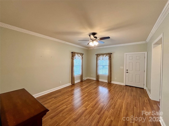 spare room featuring ceiling fan, ornamental molding, and hardwood / wood-style floors