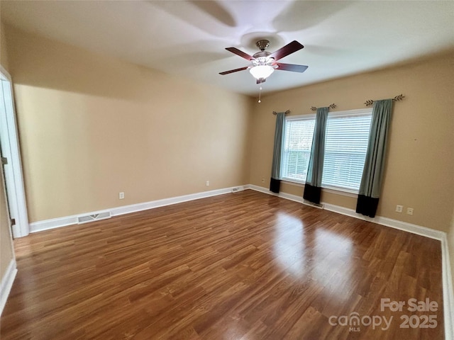 empty room featuring ceiling fan and wood-type flooring