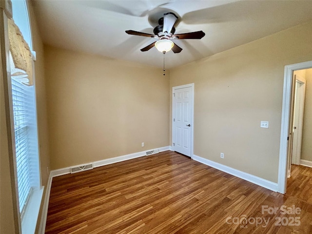 unfurnished room featuring wood-type flooring and ceiling fan