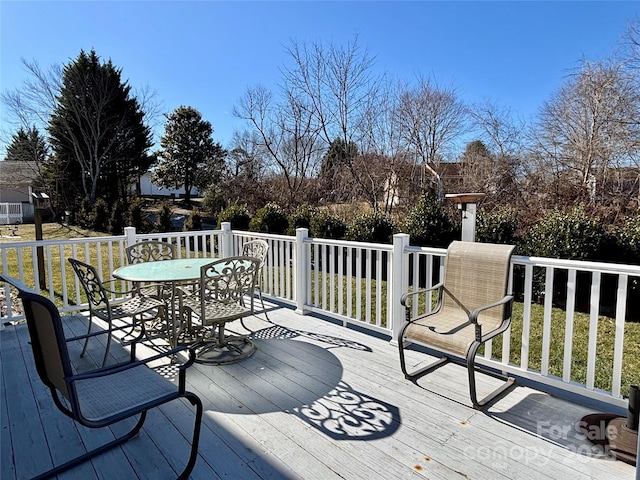 deck featuring a lawn