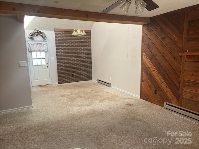 carpeted spare room with ceiling fan, beamed ceiling, wooden walls, and a baseboard radiator