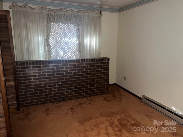 carpeted empty room with a baseboard radiator