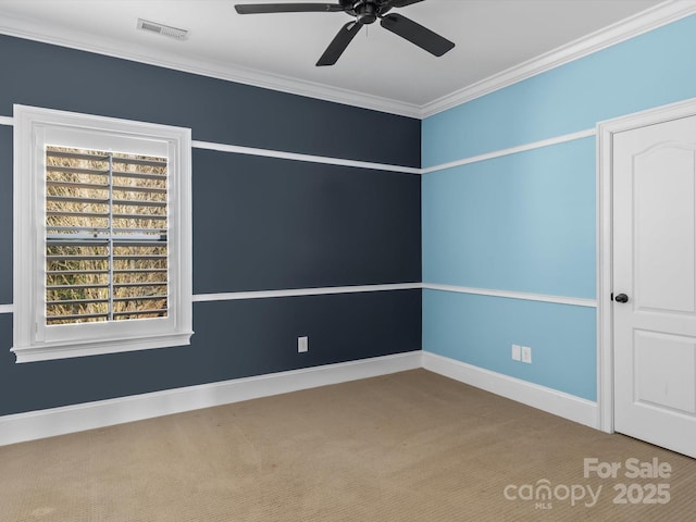 unfurnished room featuring crown molding, carpet floors, and ceiling fan