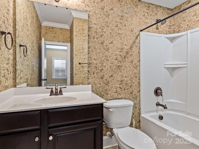 full bathroom with crown molding, bathing tub / shower combination, vanity, and toilet