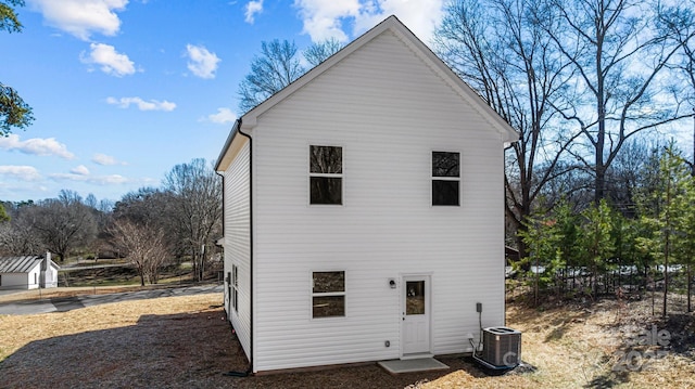 back of house featuring central AC