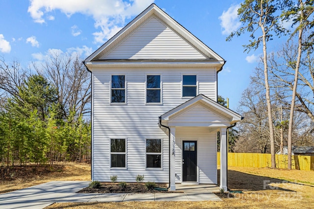 view of front of house with fence