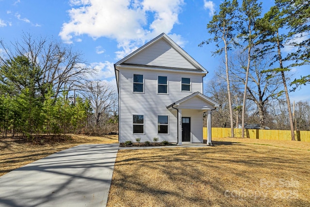 view of front of house featuring fence