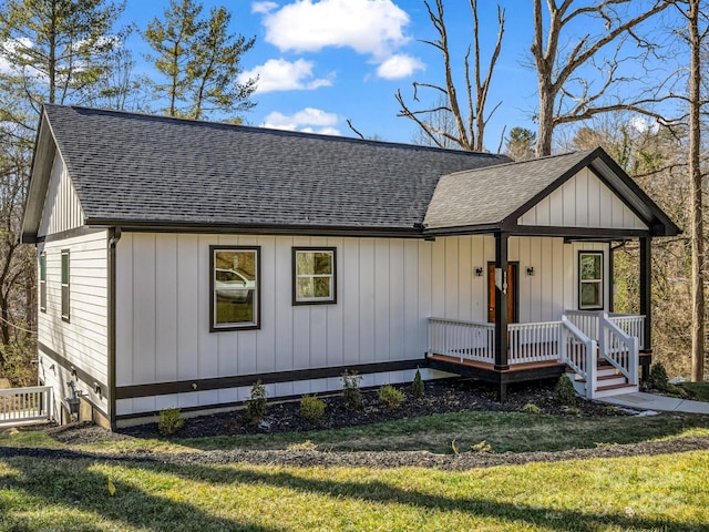 view of front of home with a front lawn and a porch