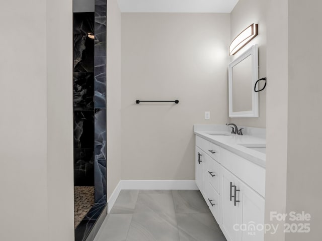 bathroom featuring vanity and a tile shower