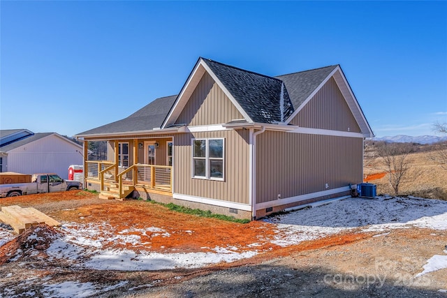 view of front of property with central AC and covered porch