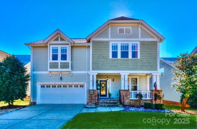 craftsman inspired home featuring an attached garage, covered porch, and driveway