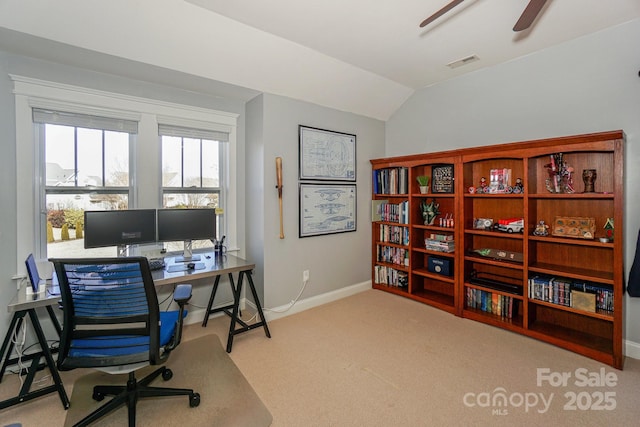 carpeted office featuring lofted ceiling and ceiling fan