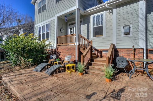 doorway to property with crawl space and a patio area