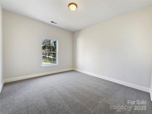 unfurnished room with carpet flooring