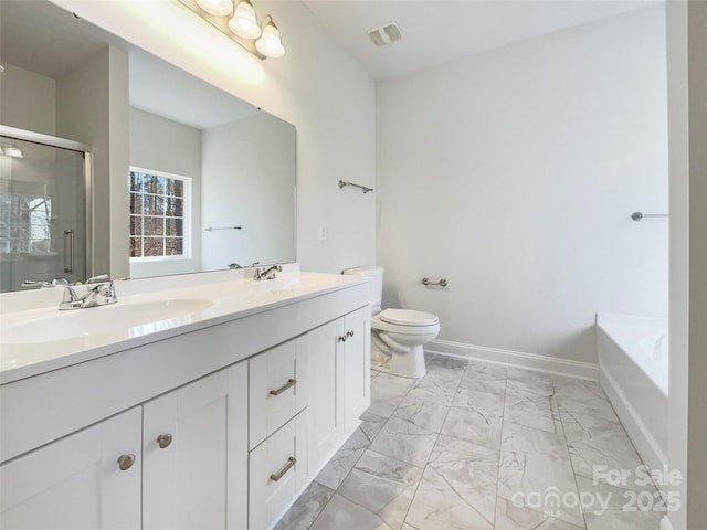 full bathroom featuring toilet, vanity, and shower with separate bathtub