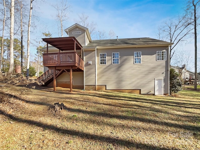 back of house with a yard and a deck