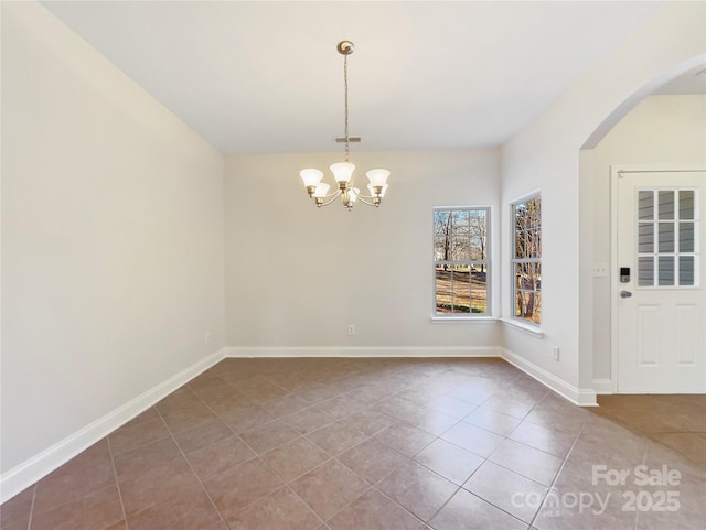 interior space with a chandelier and tile patterned flooring