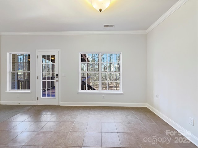 tiled spare room with crown molding