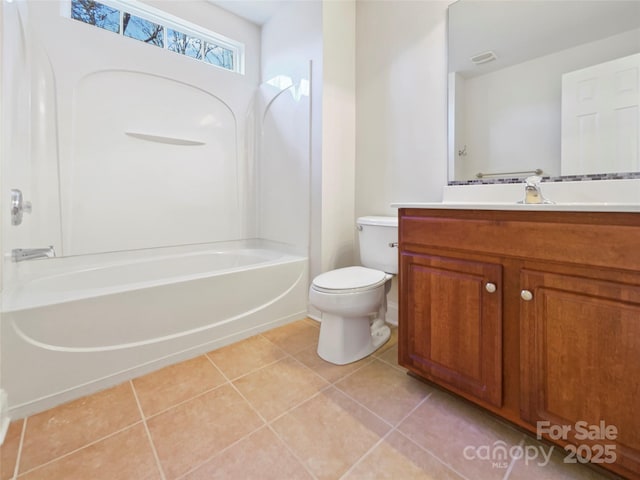 full bathroom with bathing tub / shower combination, toilet, vanity, and tile patterned flooring