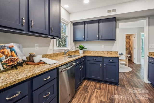 kitchen featuring blue cabinets, sink, stainless steel dishwasher, and dark hardwood / wood-style flooring