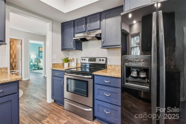 kitchen with electric stove, wood-type flooring, black fridge with ice dispenser, and light stone counters