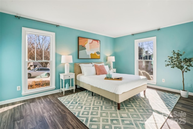 bedroom with dark hardwood / wood-style flooring