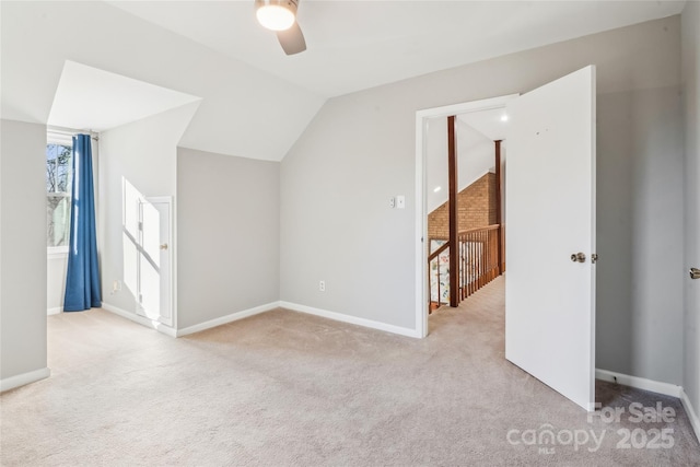 bonus room with lofted ceiling, light colored carpet, and ceiling fan