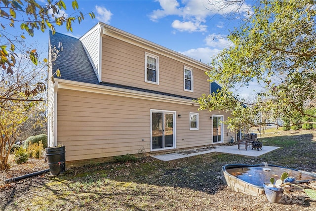 back of property featuring a patio