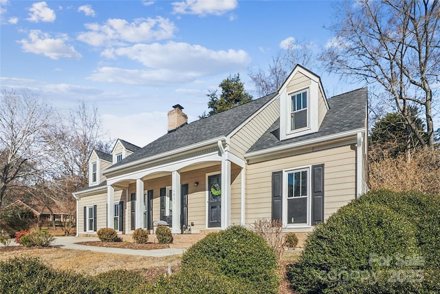 cape cod house with a porch