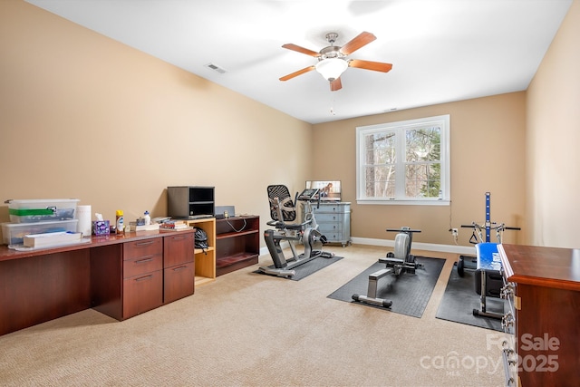 exercise area featuring carpet floors and ceiling fan