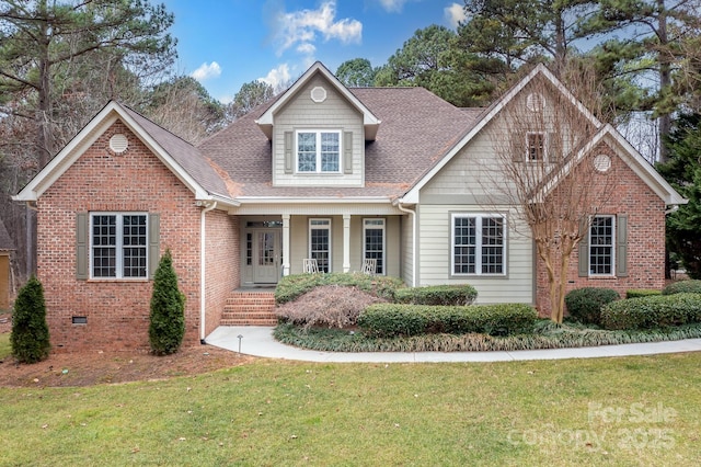 view of front of house featuring a front lawn and covered porch