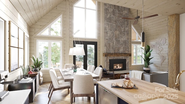 interior space with lofted ceiling, wood ceiling, a fireplace, and sink