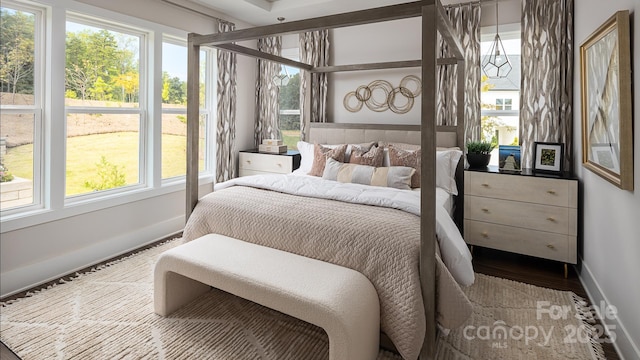 bedroom with wood-type flooring