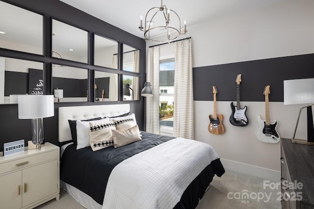 bedroom with an inviting chandelier and light colored carpet