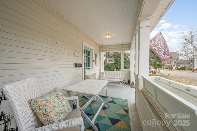 balcony featuring covered porch