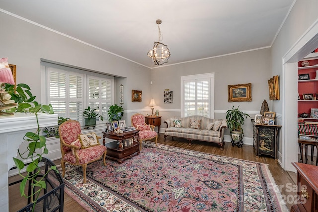 living room featuring crown molding, dark hardwood / wood-style floors, and a notable chandelier