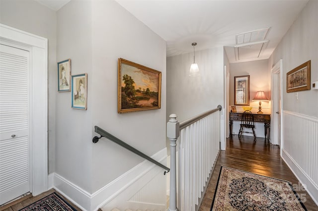 stairs with wood-type flooring