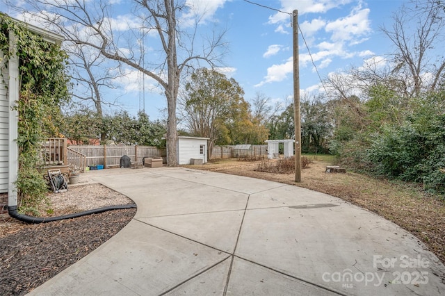 view of patio / terrace featuring a storage unit