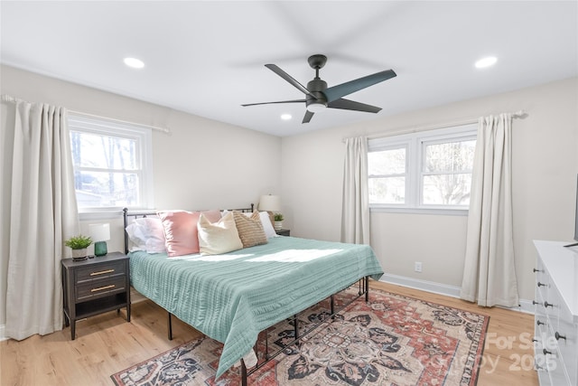 bedroom featuring ceiling fan and light wood-type flooring