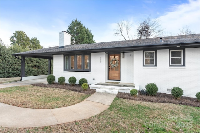 ranch-style house with a front yard