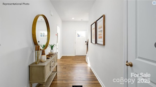 corridor with light hardwood / wood-style floors