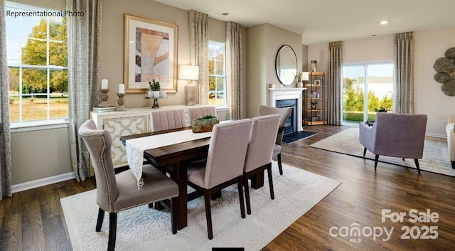 dining space with dark hardwood / wood-style floors