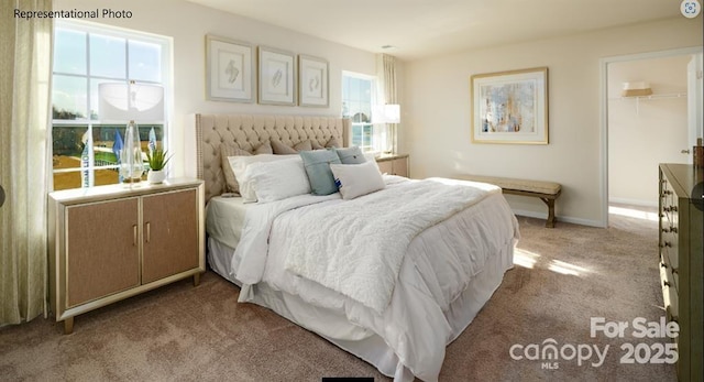 bedroom featuring light carpet