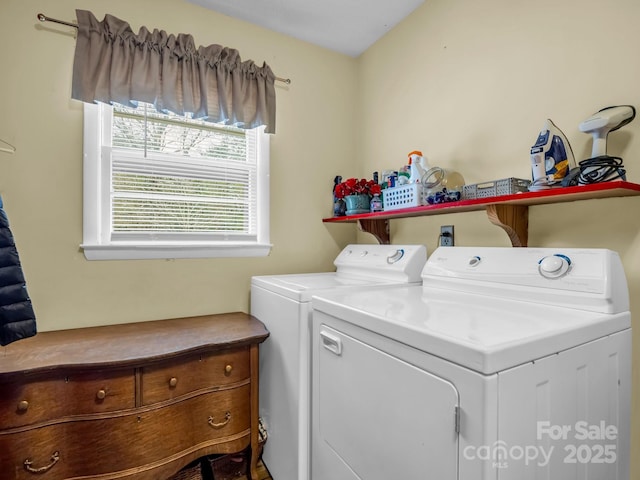 clothes washing area featuring independent washer and dryer