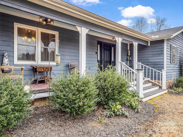 property entrance featuring covered porch