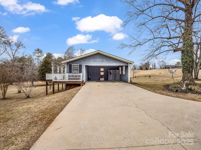 view of front of home with a wooden deck and a carport