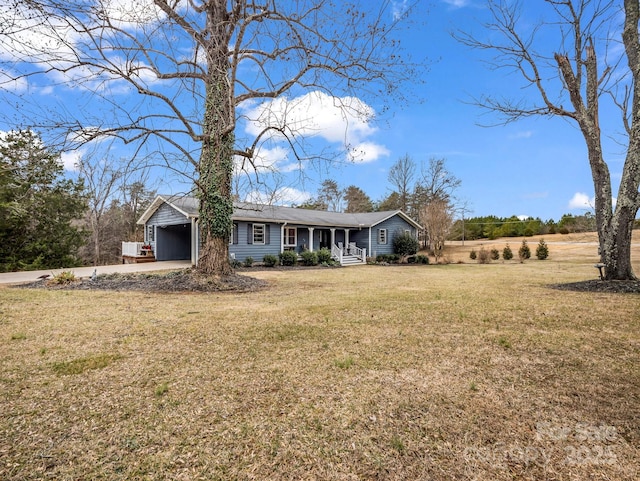 single story home featuring a garage and a front lawn