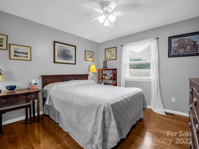 bedroom featuring ceiling fan and dark hardwood / wood-style flooring